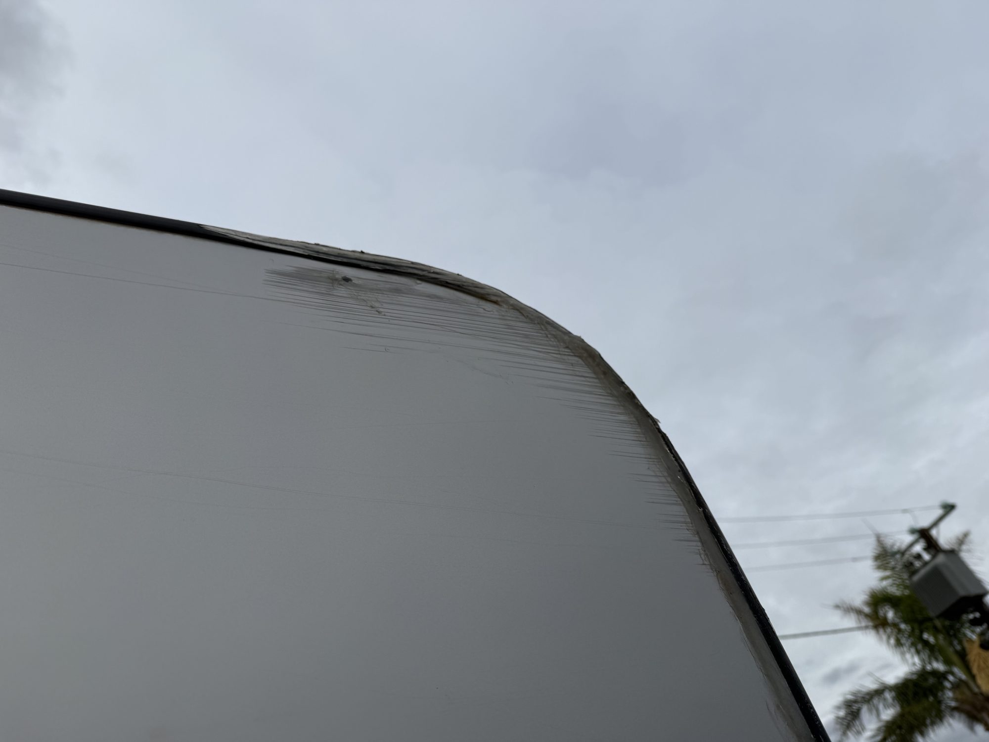 Scraped caravan front corner